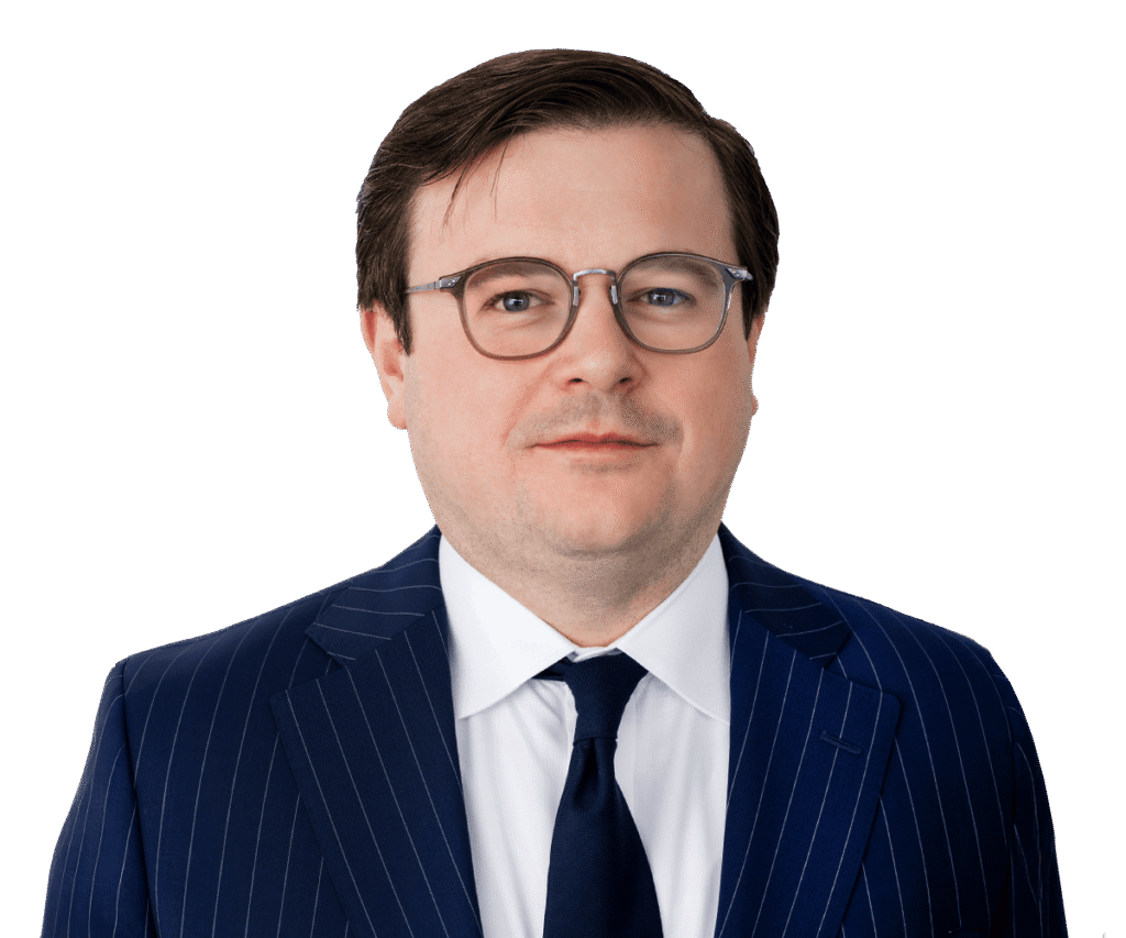 Professional headshot of a Clearbrook executive wearing a blue pinstripe suit, white shirt, and dark tie.