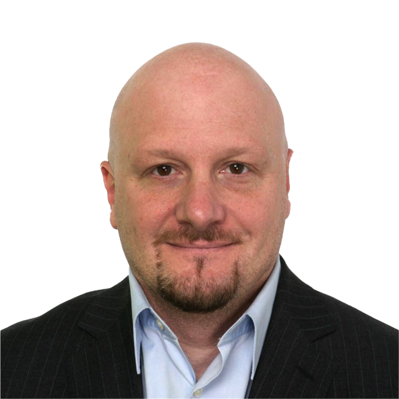 Professional headshot of a smiling bald man with a goatee wearing a dark pinstripe suit and a light blue shirt.